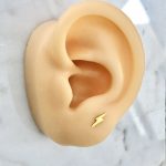 piercing rayo dorado acero inoxidable